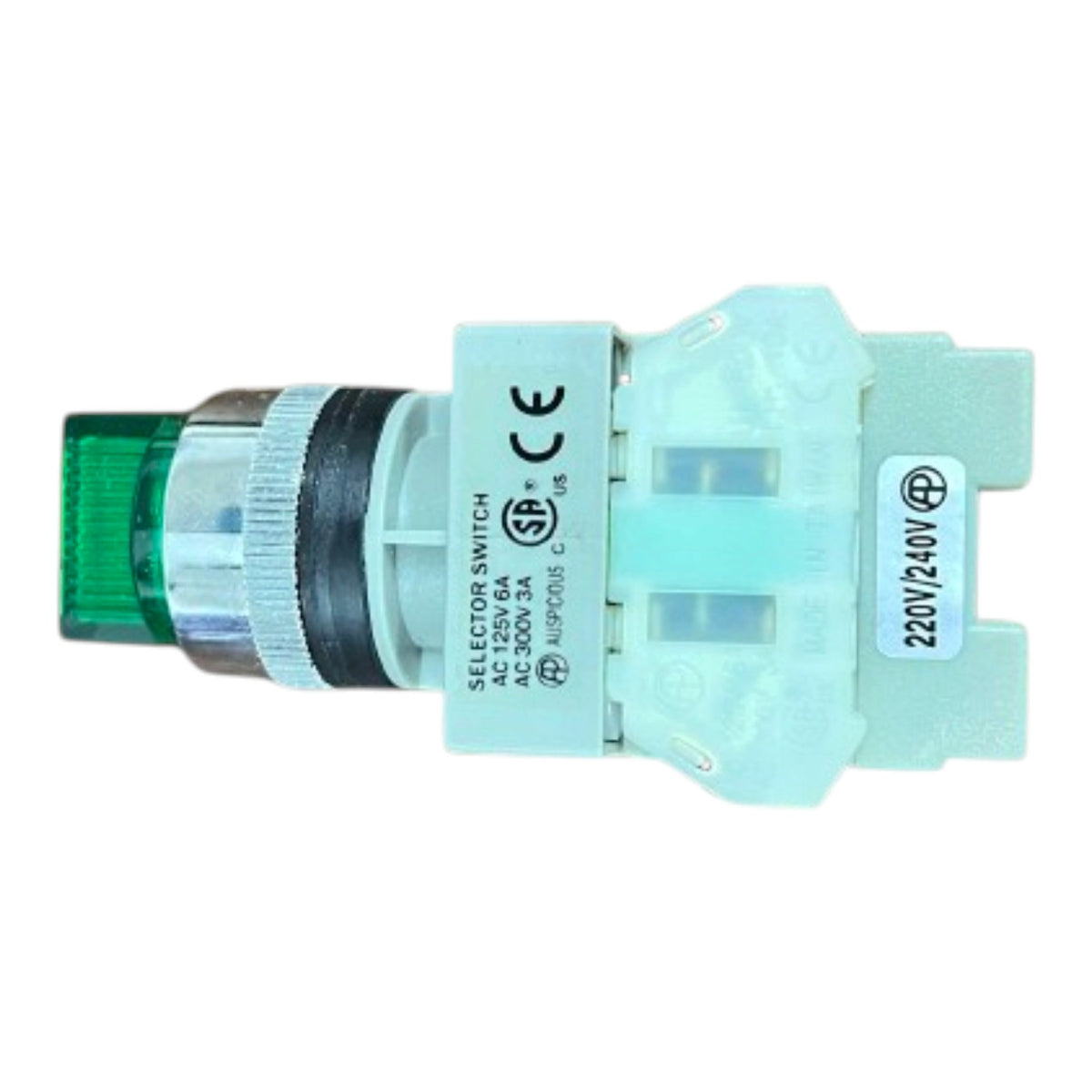 A miniature industrial selector switch with a translucent green light window, a silver ribbed metal ring, and a pale blue plastic housing with printed technical specifications.
