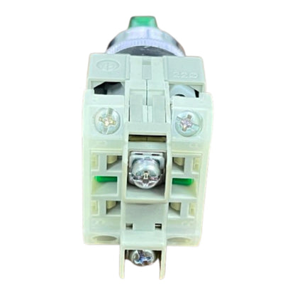 A close-up of a terminal block connector with screw terminals, a central screw, and a green button on top, isolated on a white background.