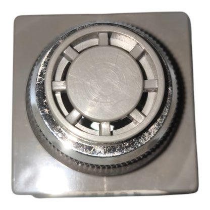 A square metallic silver control knob with a textured outer ring and a circular center, shown on a plain white background.