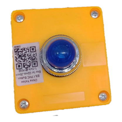 A square yellow PVC button cover with a central blue push-button and silver metal bezel, shown on a plain white background. A white product label with a QR code is attached on the left side.
