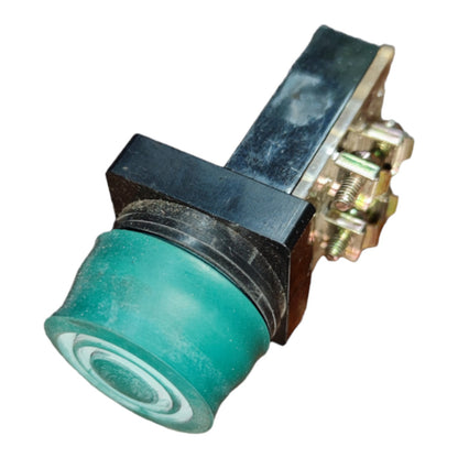 A small industrial toggle switch with a translucent teal-green button face, a black rectangular housing, and a metal terminal block with screws on a white background.