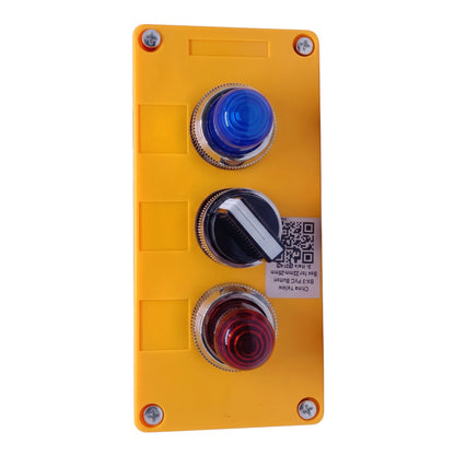 A yellow industrial control panel featuring three vertically aligned push buttons: a blue button on top, a black button in the middle with a white diagonal indicator, and a red button on the bottom. The panel is secured with four silver screws and has a small QR code label on the right side.