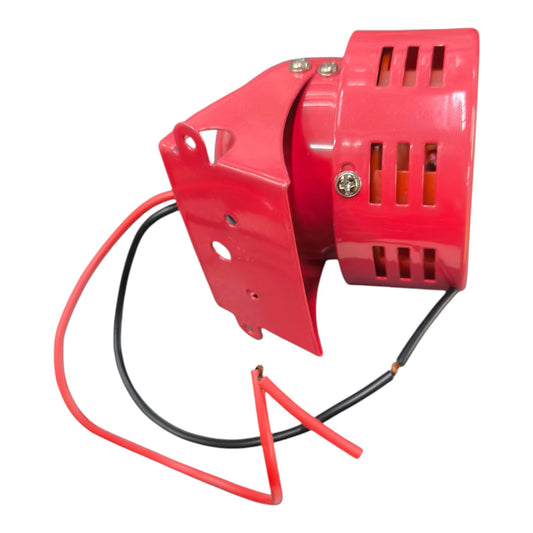 A red industrial alarm bell with a metal mounting bracket and two wires (one red, one black) on a plain white background.
