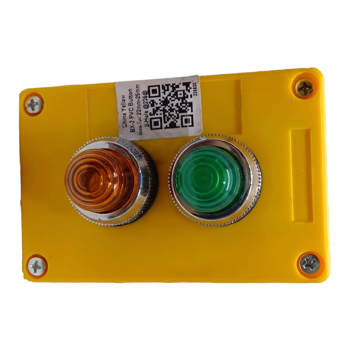 A yellow industrial control panel featuring a dual-button switch. The left button has a clear amber lens, and the right button has a green lens.