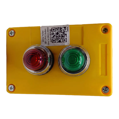 A yellow industrial push-button panel with a red emergency stop button on the left and a green start button on the right, secured with screws and featuring a white QR code label.