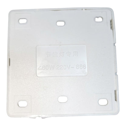 A white plastic electrical switch plate cover with mounting holes and Chinese text printed in the center, shown on a white background.