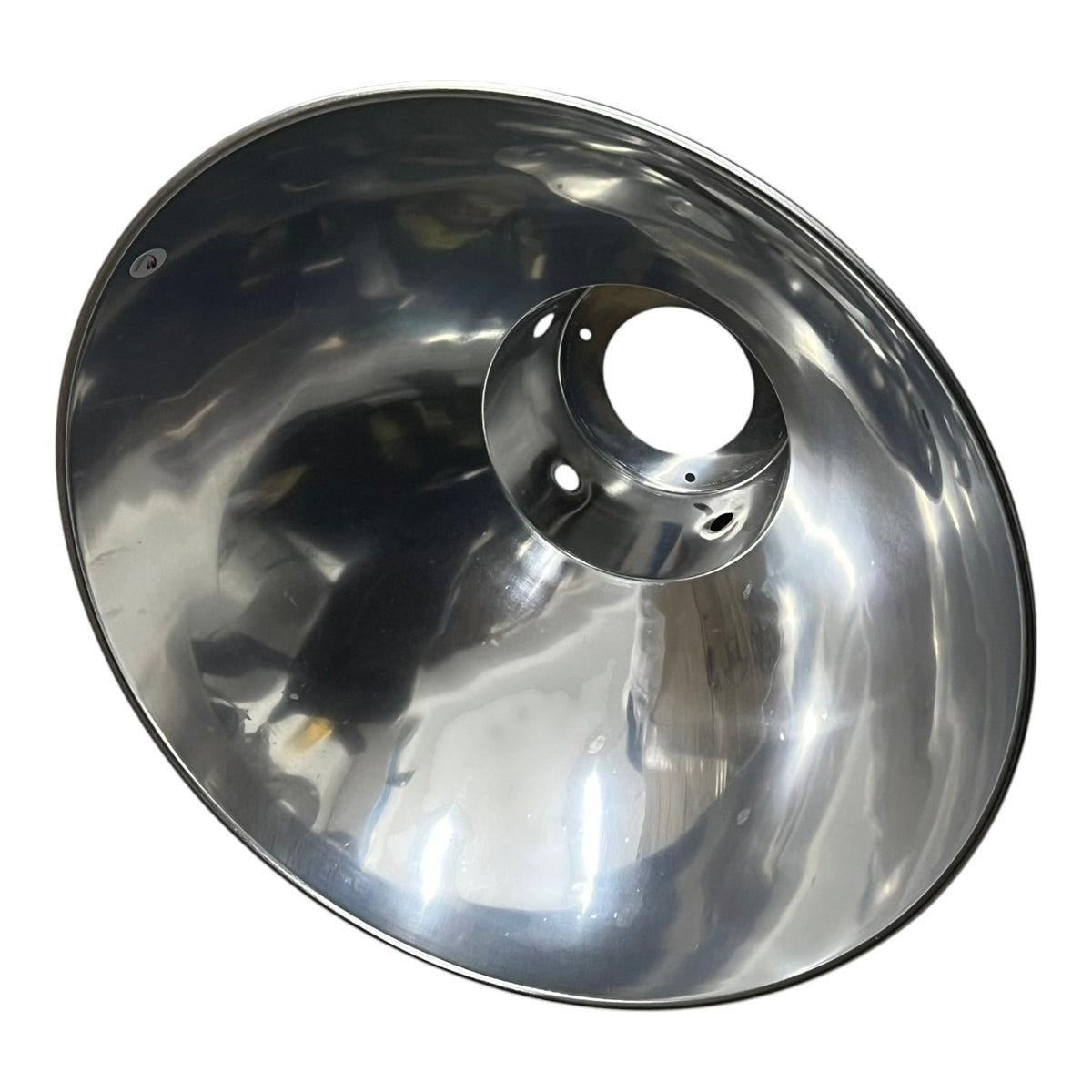 A polished stainless steel reflector bowl, likely a spotlight or searchlight reflector, shown from a top-down perspective on a white background.