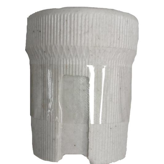 White cylindrical object with ribbed texture on a white background