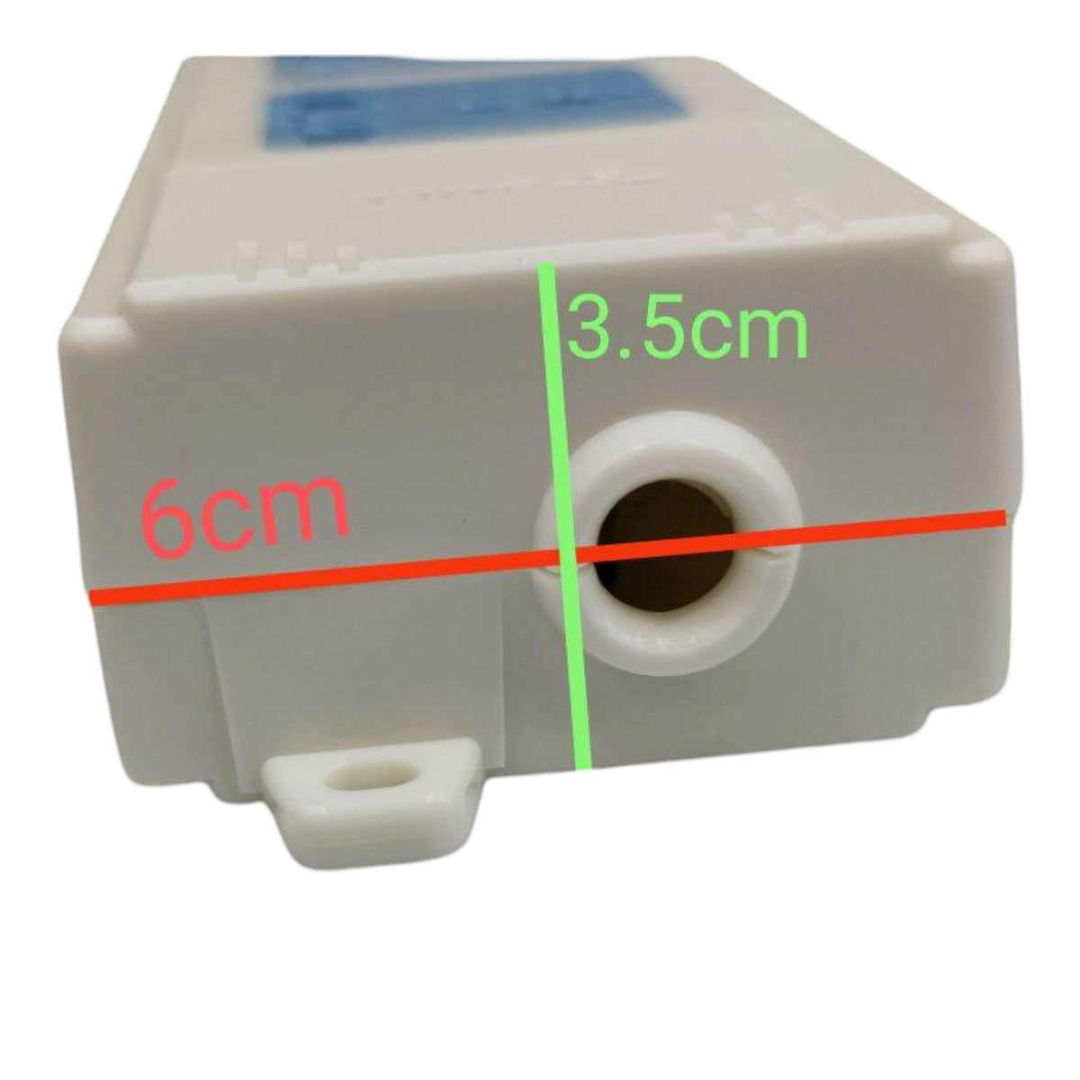 A white plastic rectangular container or pump housing with a circular port on the front, overlaid with red and green measurement lines and text labels reading 6cm and 3.5cm on a plain white background.