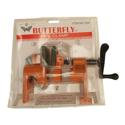 An orange butterfly pipe clamp in its original clear plastic retail packaging with a white and red header card.