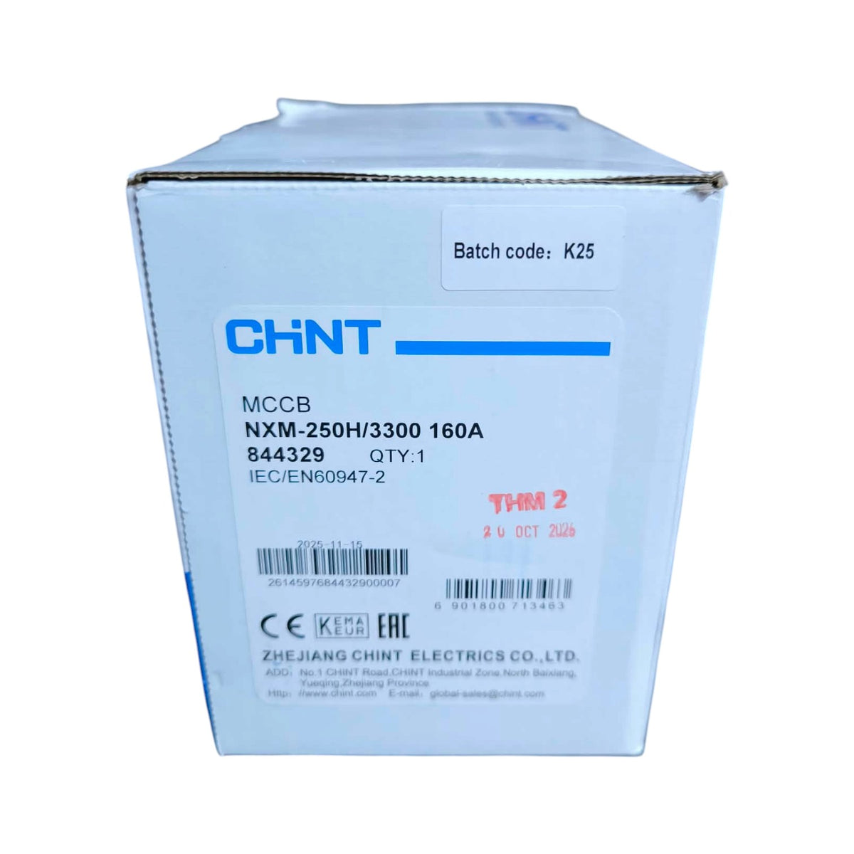 A white cardboard box for a CHNT MCCB product, featuring blue and black printed text and a white label with a batch code.