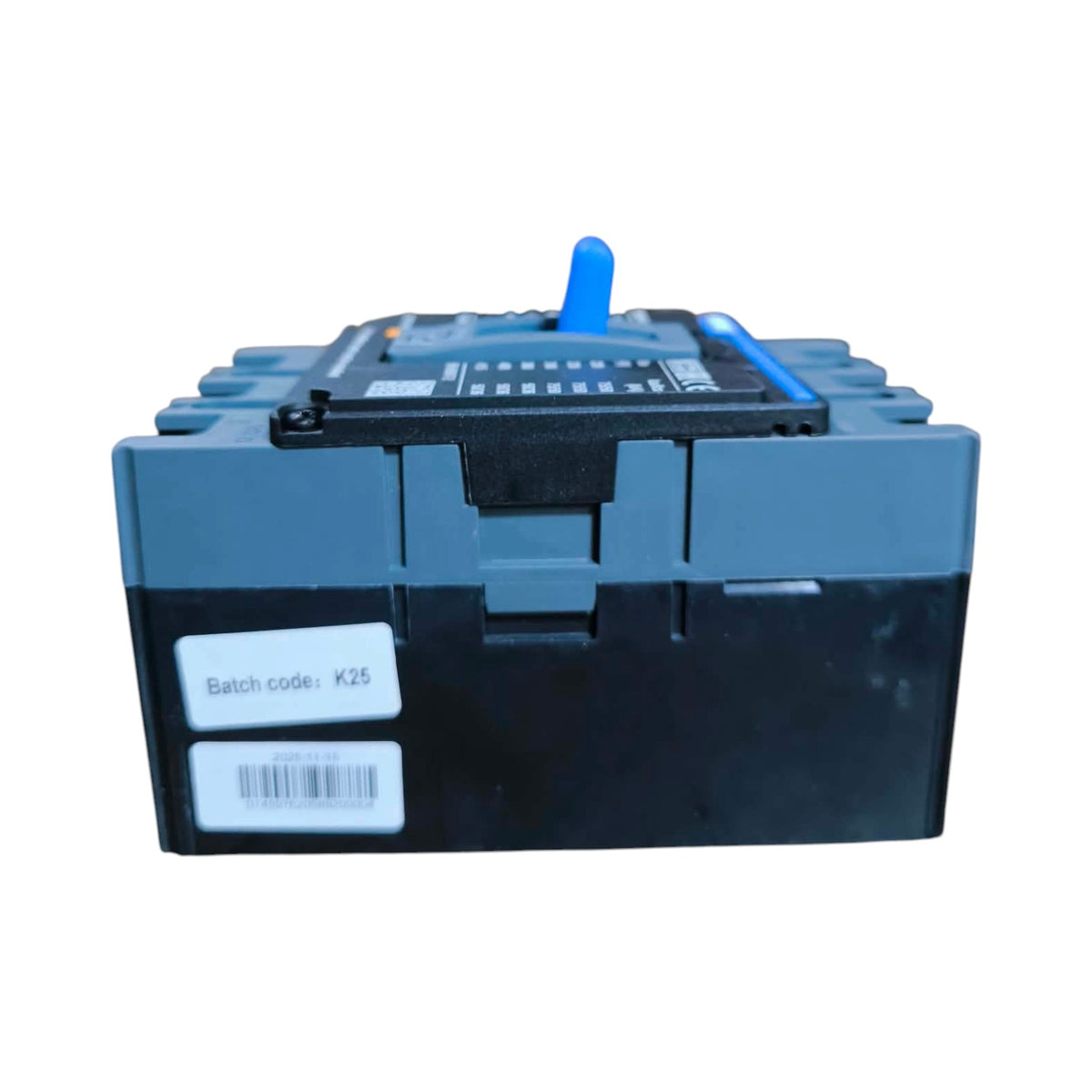 A heavy-duty industrial plastic container or block with a dark blue-gray upper section and a black lower section, featuring a blue handle on top, a black label, and two white labels on the front including one with a barcode.