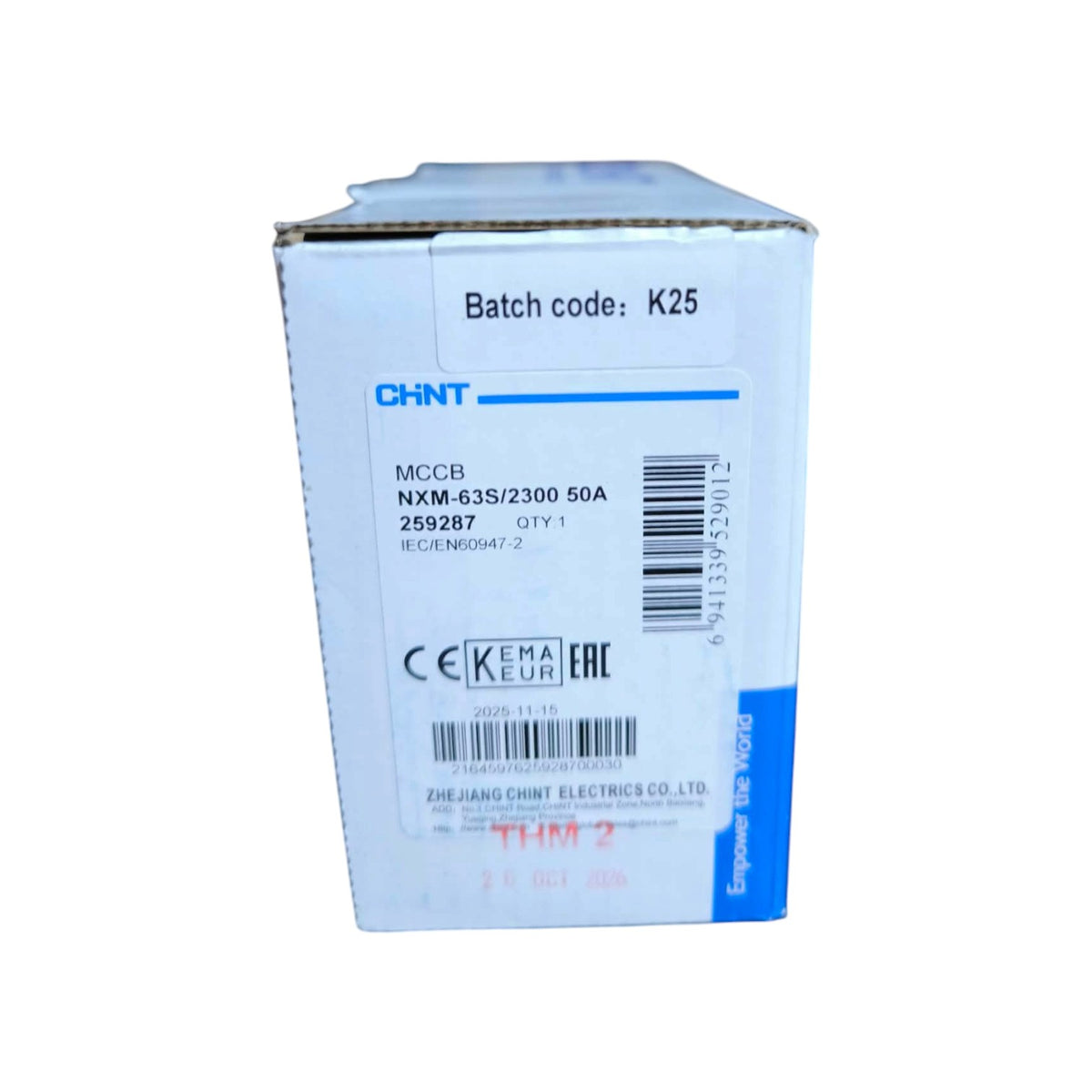 A white cardboard product box with blue and black printed text and barcodes, photographed on a plain white background. The box shows the CHNT brand and product details including batch code K25.