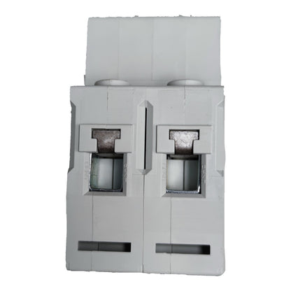 Gray plastic component with multiple slots and openings on a white background