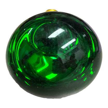 A round, glossy dark green glass ornament with a small gold hanging loop at the top, shown against a plain white background.
