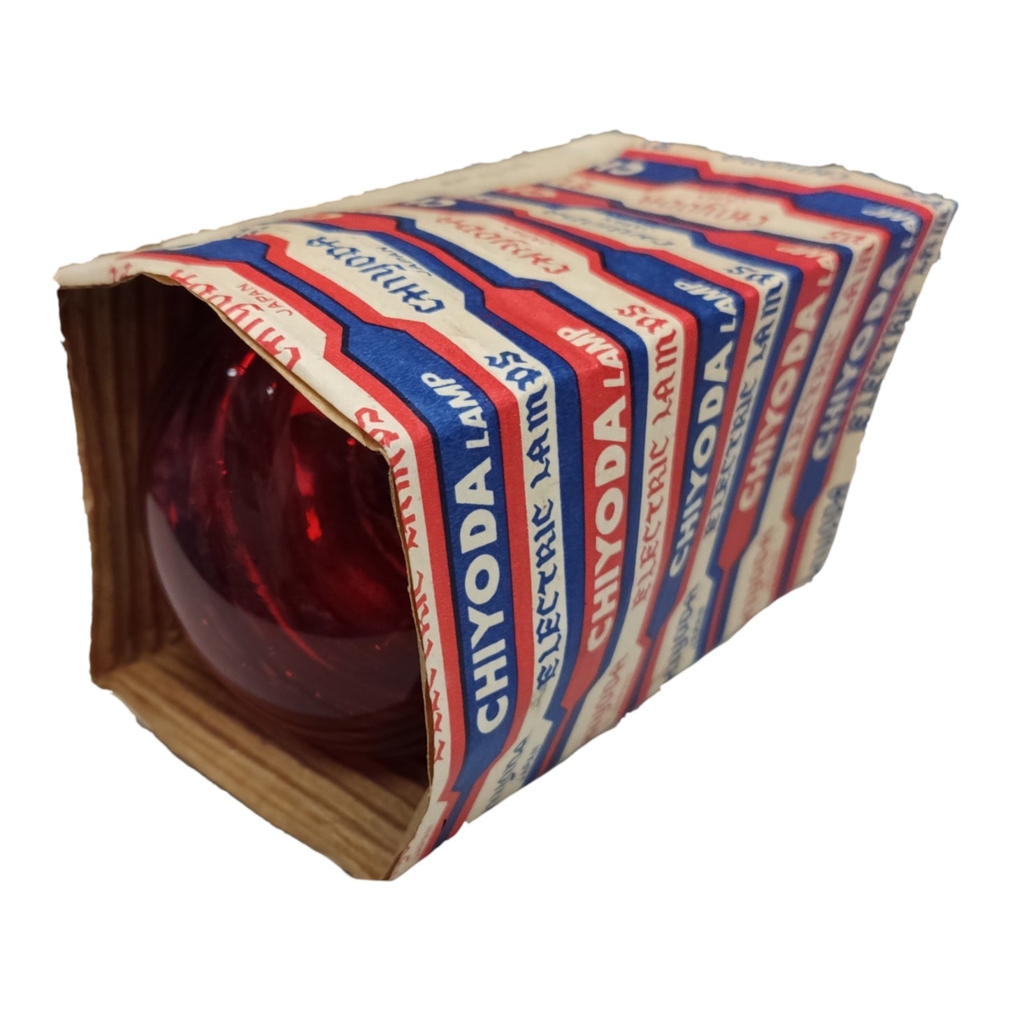 A vintage Chiyoda Electric Lamp with a red glass bulb visible inside a cardboard sleeve wrapped in branded paper.