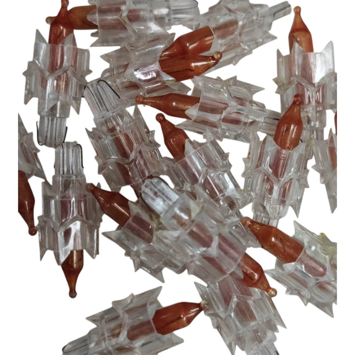 Cluster of clear and brown plastic components on a white background