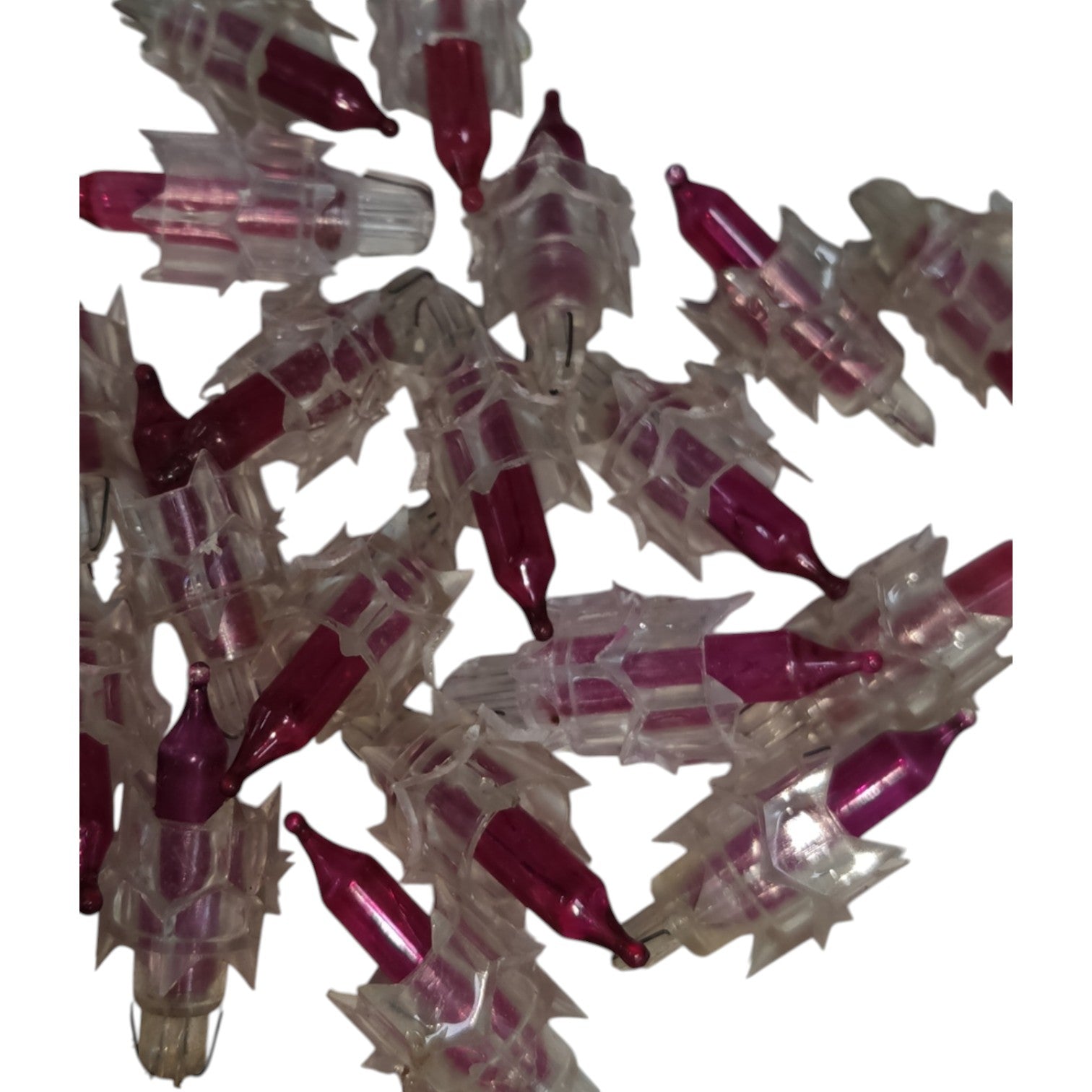 Cluster of red and clear plastic objects on a white background
