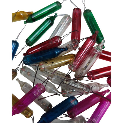 Colorful glass tubes with wires attached on a white background