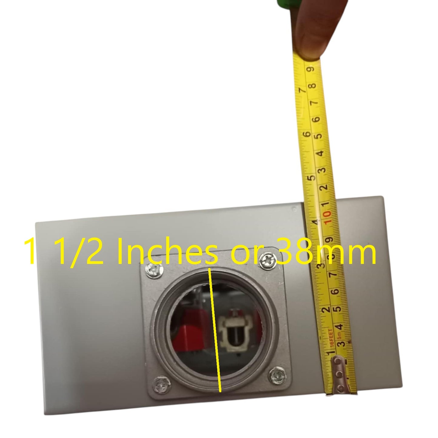 Metallic electrical outlet with a measuring tape indicating dimensions on a white background