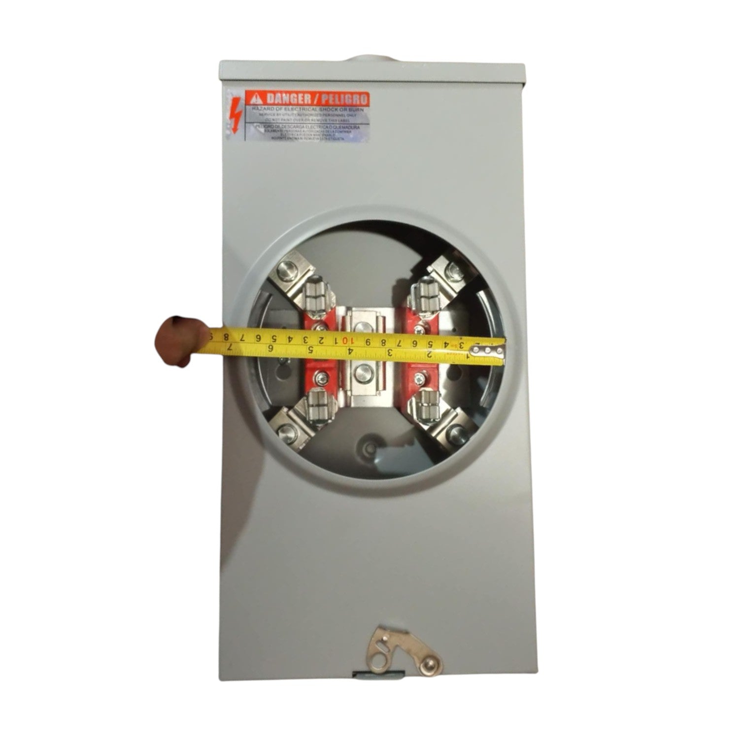 Electrical panel with a tape measure for scale on a white background