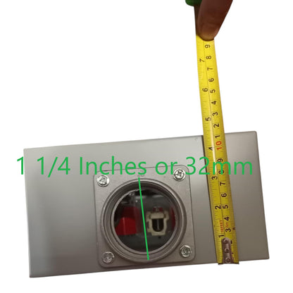 Metallic electrical junction box with a measuring tape indicating dimensions on a white background
