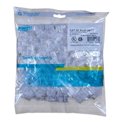 A clear plastic bag containing many CAT 5E RJ45 jack connectors, with a white product label and blue Tyco Electronics branding visible on the packaging.