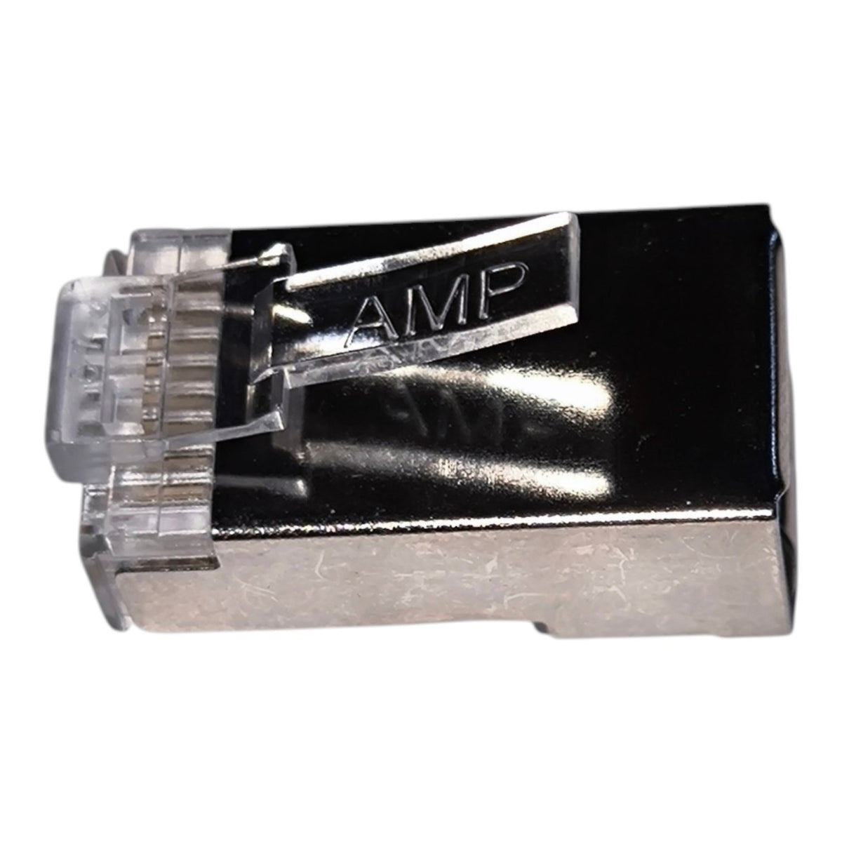 A single RJ45 Ethernet connector with a black plastic frame, silver metal contacts, and a clear plastic locking tab stamped with the letters 'AMP'.