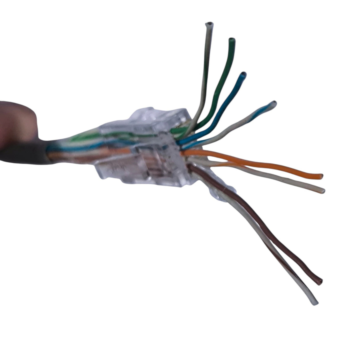 A close-up of a multi-core CAT6 cable connector with exposed wires in blue, green, orange, brown, and white, held by a hand against a white background.