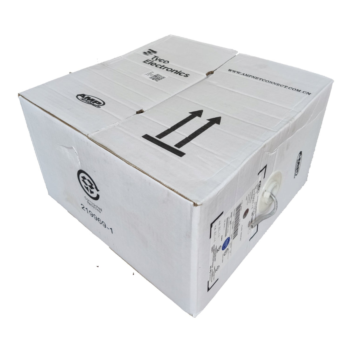 A white corrugated cardboard shipping box with printed black arrows, handling symbols, and text including 'Nexco Electronics' and a website URL, photographed on a plain white background.