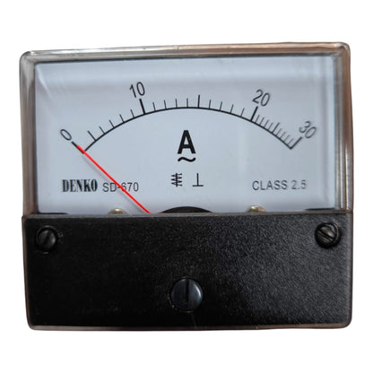 A Denko SD-670 analog ammeter with a black metal housing, clear protective cover, and a white dial face showing current measurements up to 30 Amps.