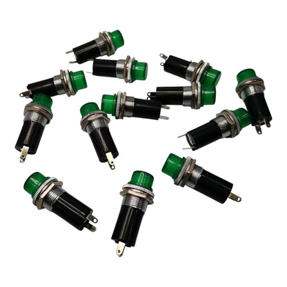 Ten green and black push-in button switches with silver metal pins, arranged on a plain white background.