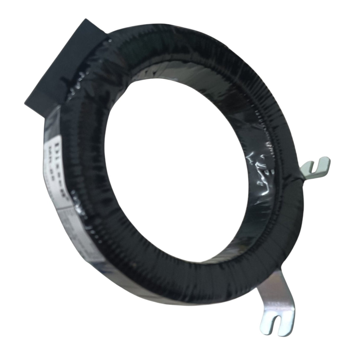 A black insulated ring-shaped component, likely a transformer or inductor, wrapped in black tape and secured with a white label, featuring two silver metal tabs on a plain white background.