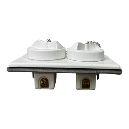 A dual outdoor water fountain spigot set with two white plastic caps on a square white base, featuring two gray rectangular supports below with amber glass nozzles, shown on a white background.