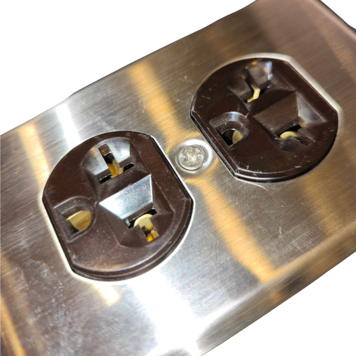 Close-up of a brushed stainless steel electrical outlet cover plate with two dark brown NEMA 5-15R outlets and a small silver screw in the center.