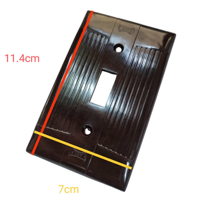 A glossy black plastic double-gang light switch plate shown at an angle with red and yellow measurement lines and text indicating dimensions 11.4cm and 7cm on a white background.