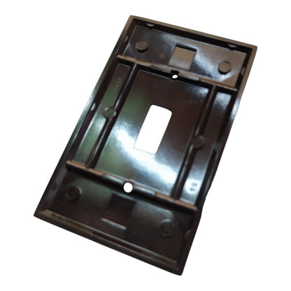 A dark brown molded plastic light switch plate cover with a single toggle switch cutout, shown on a plain white background.