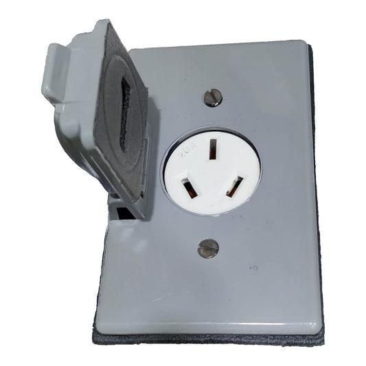 A gray electrical outlet cover plate with a three-pin socket and a hinged protective flap swung open, shown against a plain white background.