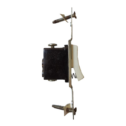 A single light switch lever with a black rectangular base, brass metal contacts and screws, and a white plastic toggle, isolated on a white background.