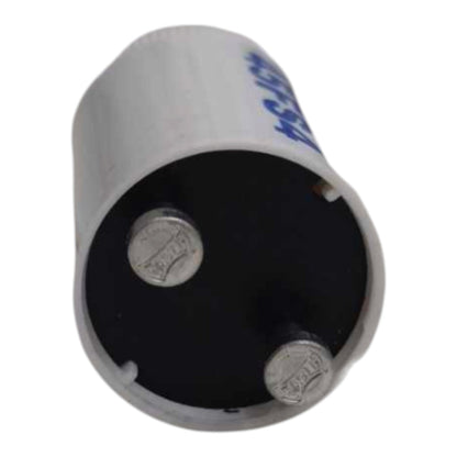 A cylindrical silver metal capacitor with a black internal plate and two visible silver terminal posts, photographed on a plain white background.