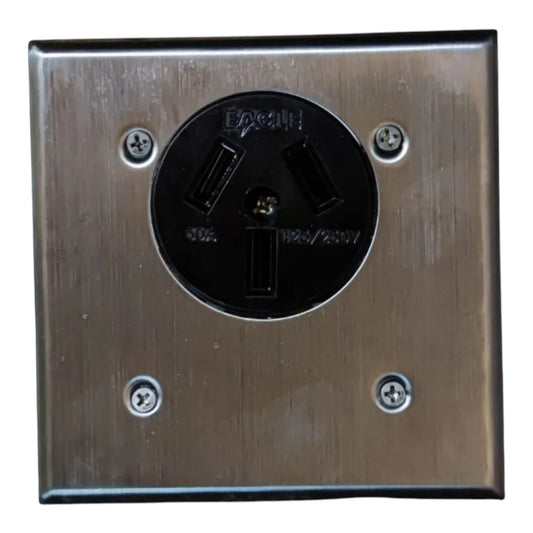 A square brushed metal electrical outlet cover plate with a black three-prong outlet in the center, secured by four screws.
