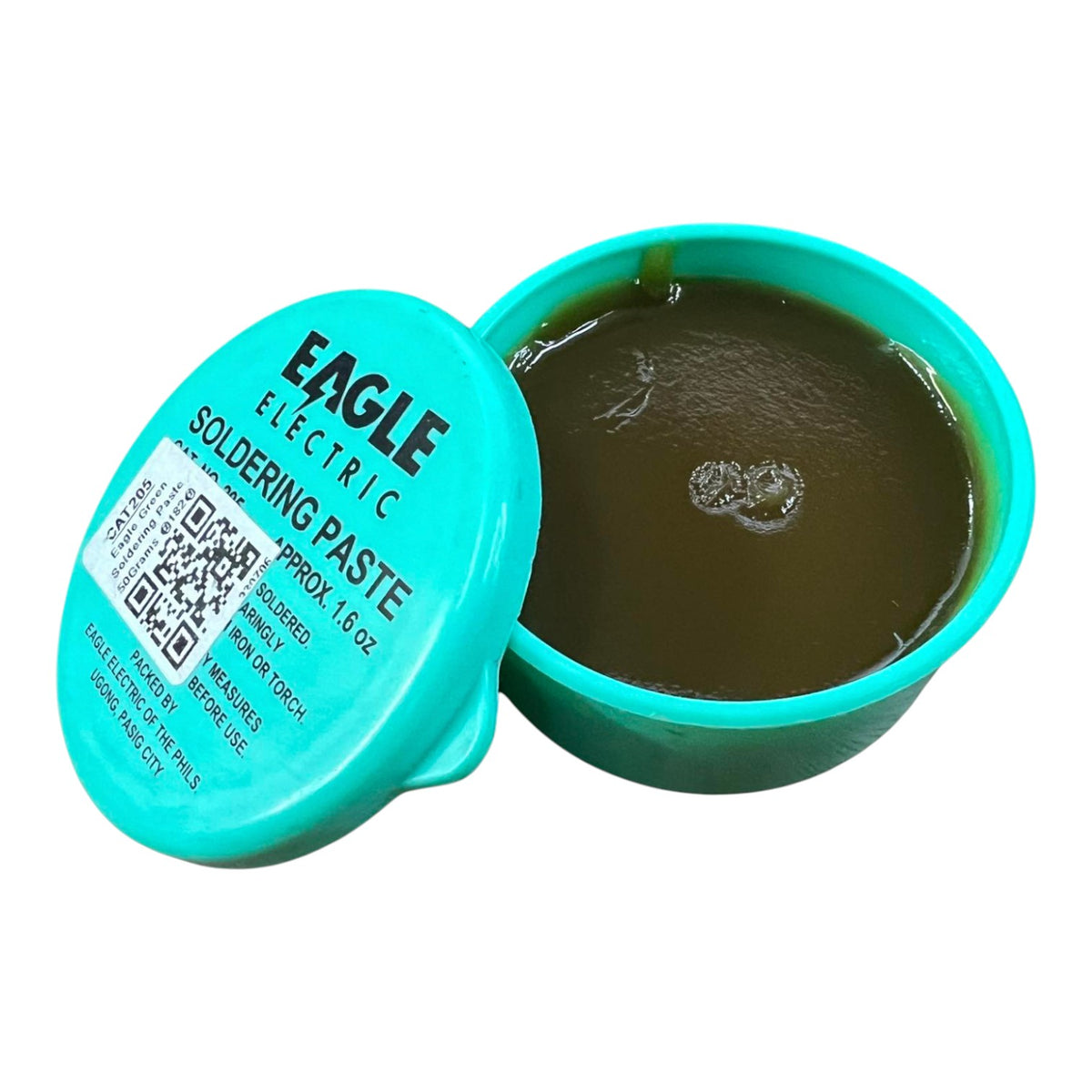 Eagle Electric Soldering Paste in a 1.6 oz round container, with the turquoise lid leaning against the open container showing the dark olive-green paste inside.