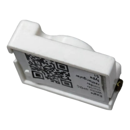 A white plastic electronic component, likely a guitar pickup coil or sensor, featuring a printed label with a QR code and text including 'rectangular sensor' and 'Egrets'.