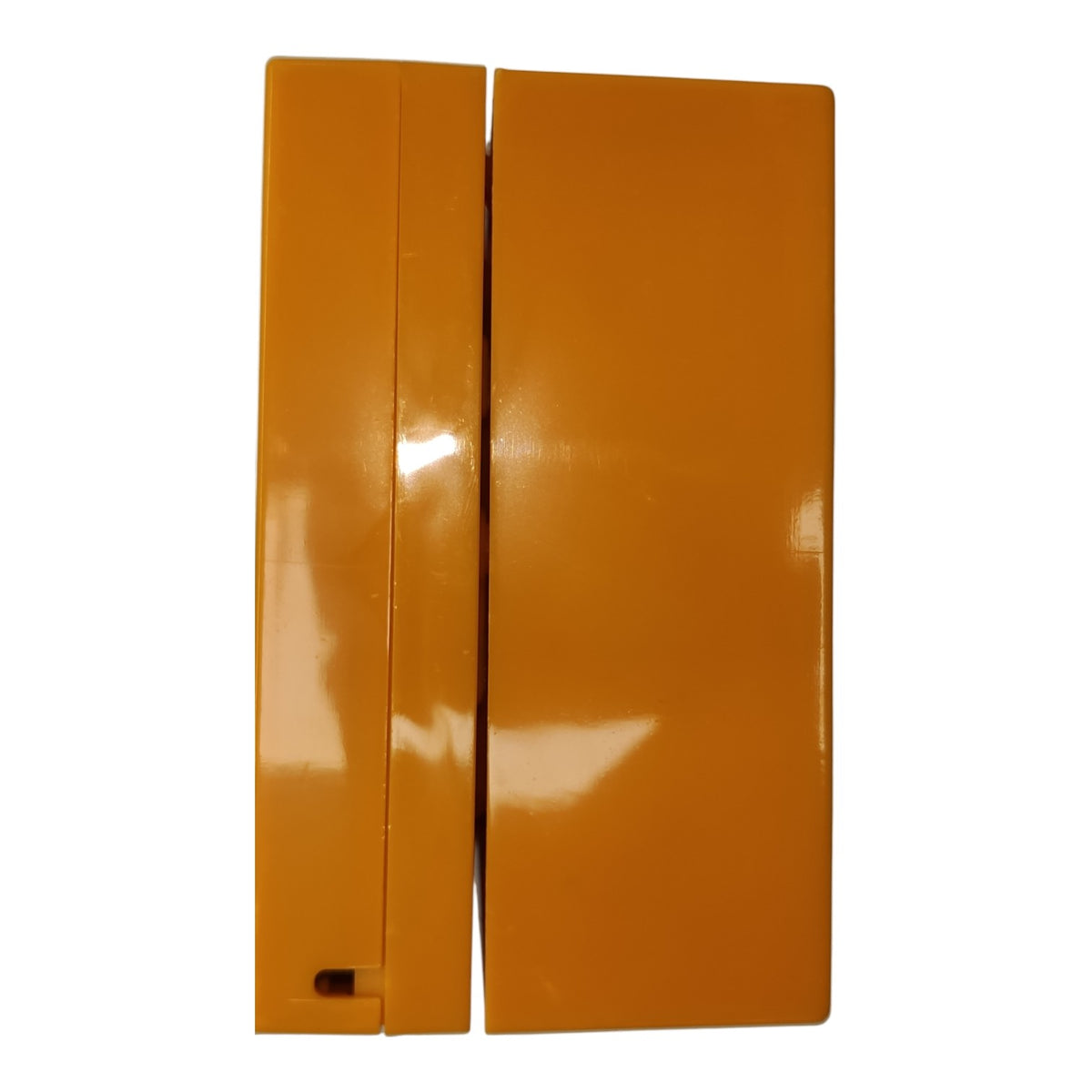 Two glossy orange rectangular plastic pieces shown upright against a plain white background.