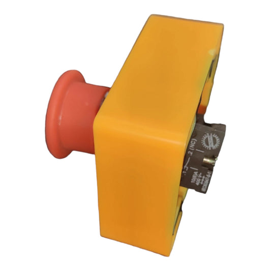 An industrial electrical push-button switch with a bright yellow housing and a red mushroom-shaped button, shown on a plain white background.