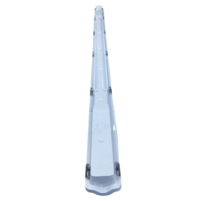Clear plastic object with a central button on a white background