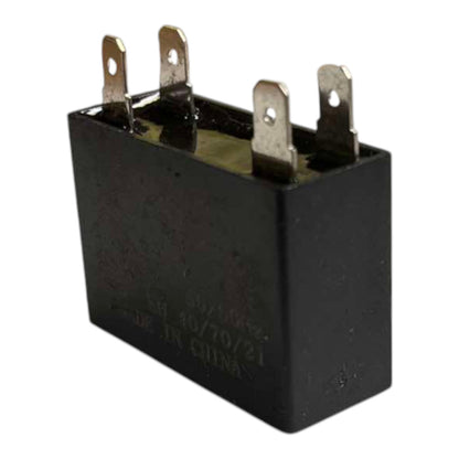 Black relay component with metallic contacts on a white background