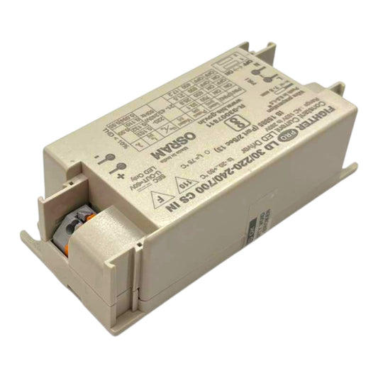 A beige industrial electronic driver module with printed specifications and terminal openings, photographed on a plain white background.