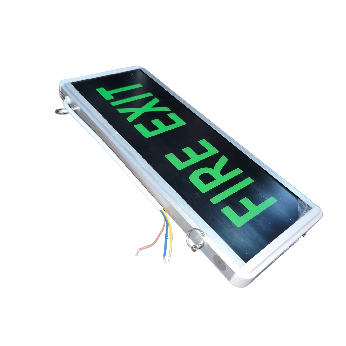 An emergency fire exit sign with a silver metal frame, a black backlit display showing 'FIRE EXIT' in bright green, and visible wiring at the bottom left, photographed on a white background.