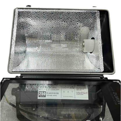 Fluorescent light bulb in a metal fixture with visible branding and specifications.